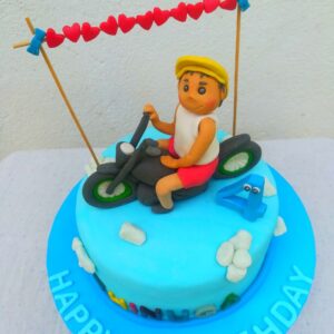 Fondant boy on the bike cake