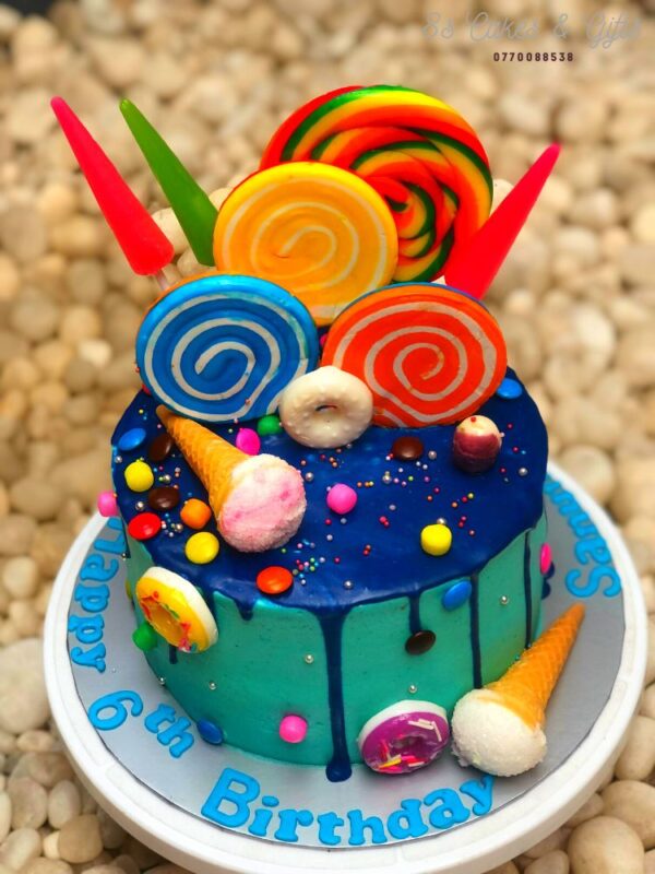 chocolate drip cake decorated with candy